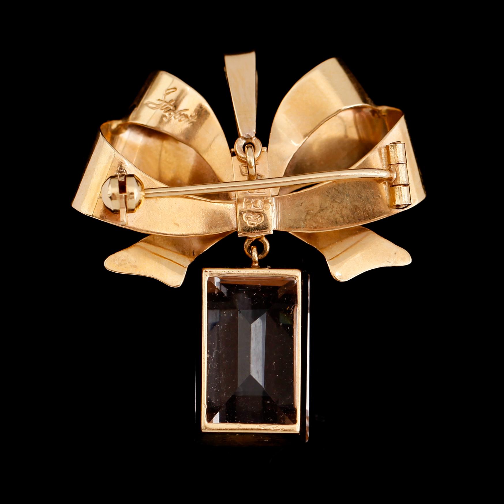 HÄNGE/BROSCH, 18 k guld och bergkristall, Stigbert, Stockholm 1944. Total vikt ca 7 g.