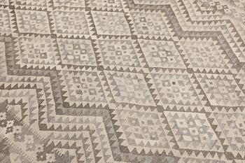 A Kilim rug, approx. 290 x 203 cm.
