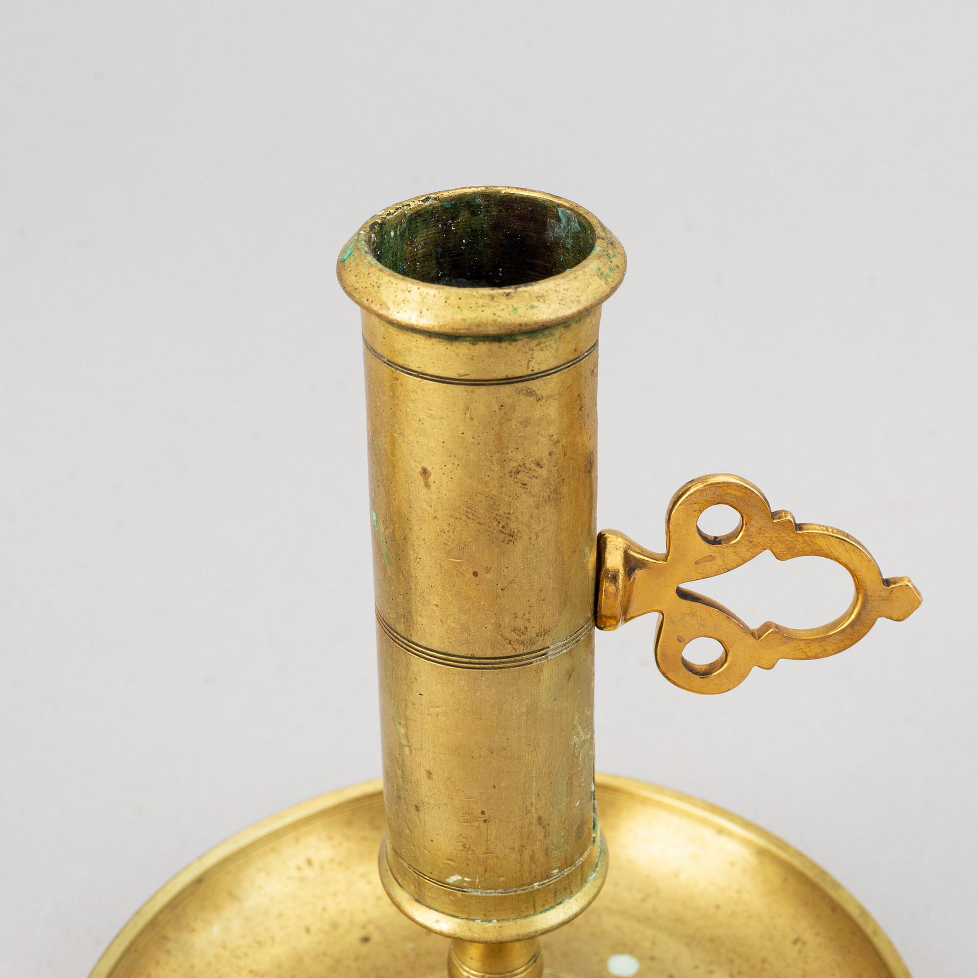 A set of six 19th-century brass candlesticks.
