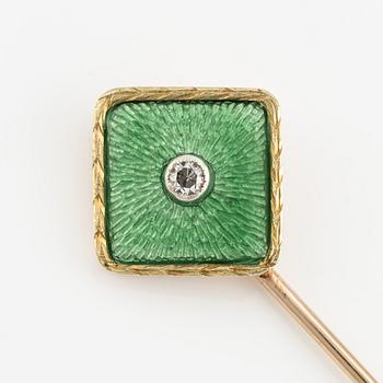 A tie pin 14K gold and guilloché enamel with a diamond.