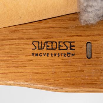 Yngve Ekström, an oak 'Lamino' easy chair with foot stool  for Swedese,