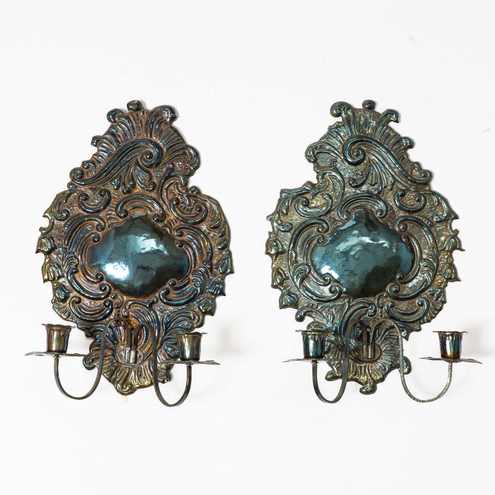 A pair of Rococo-style silver-plate sconces, early 20th century.