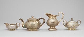 A RUSSIAN PARCEL-GILT FOUR PIECE TEA-SET, different makers, Moscow 1873-1908.