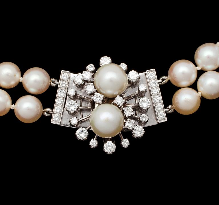 A two strand cultured pearl necklace, app, 8,2 mm, with diamond clasp app. 1.80 cts, 1980's.