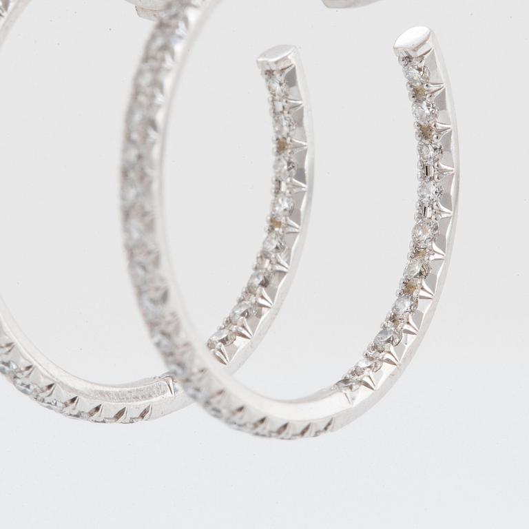 A pair of Tiffany "Metro" 18K white gold hoops set with round brilliant-cut diamonds.