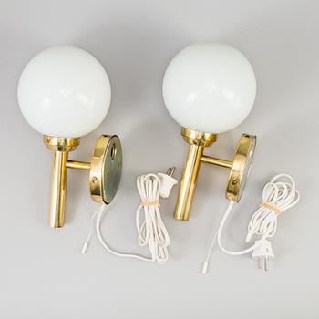 A pair of 20th century brass wall lights by Abo Denmark.