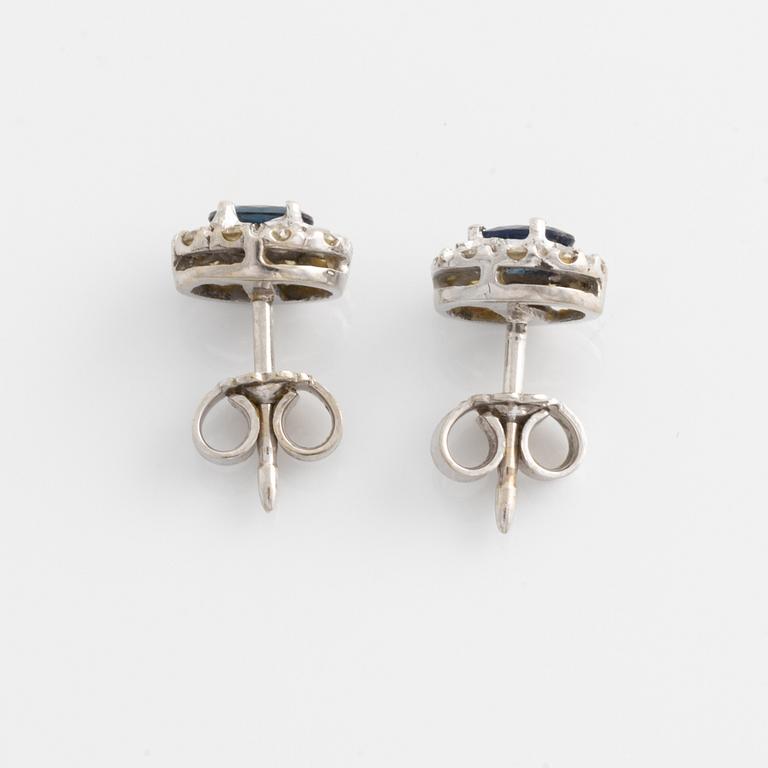 Pendant and a pair of earrings, white gold with sapphires and brilliant-cut diamonds.
