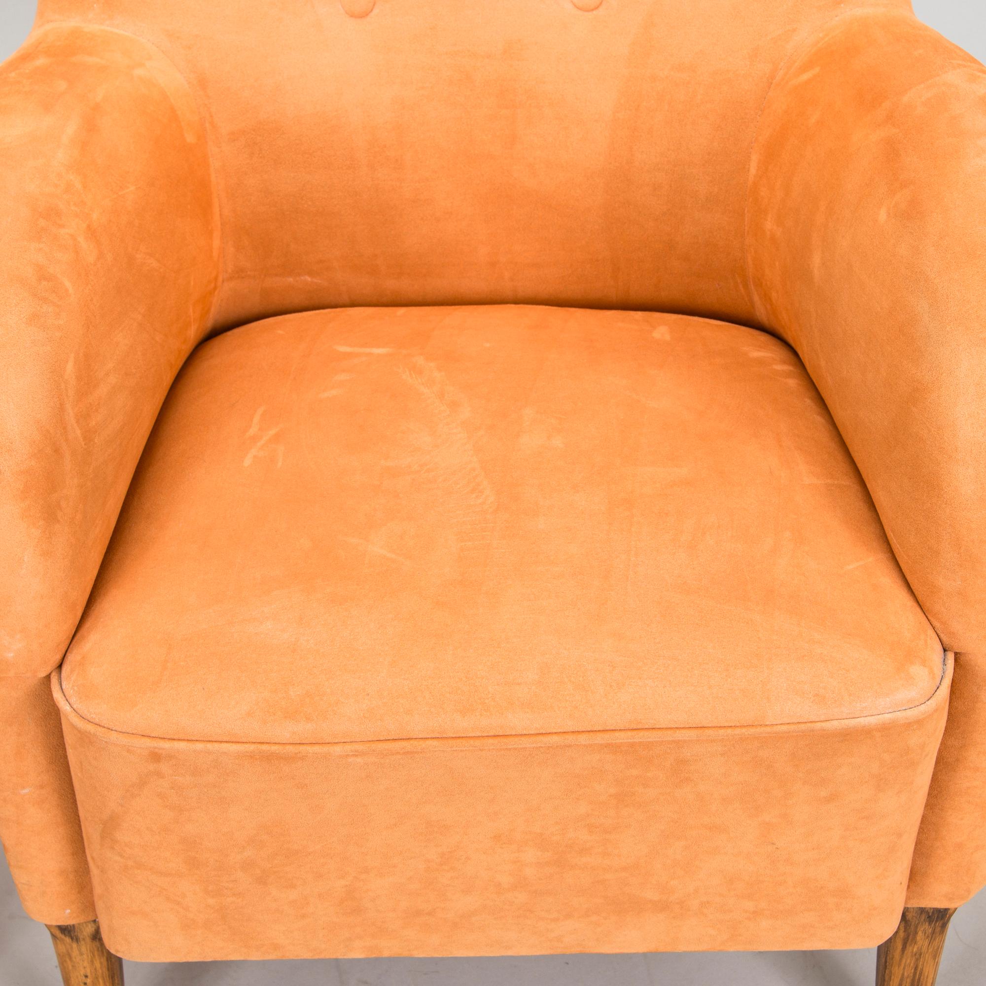 A pair of mid-20th century armchairs.