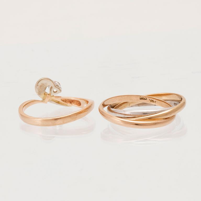 Rings, 2 pcs, 14K gold and round brilliant-cut diamond.