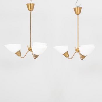 A pair of  ASEA Belysning brass 1950s ceiling pendants.