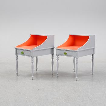 A pair of 20th Century bedside tables.
