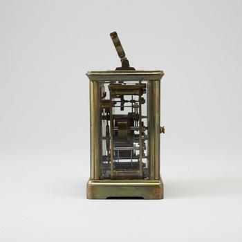 An early 20th century brass and glass carriage clock.