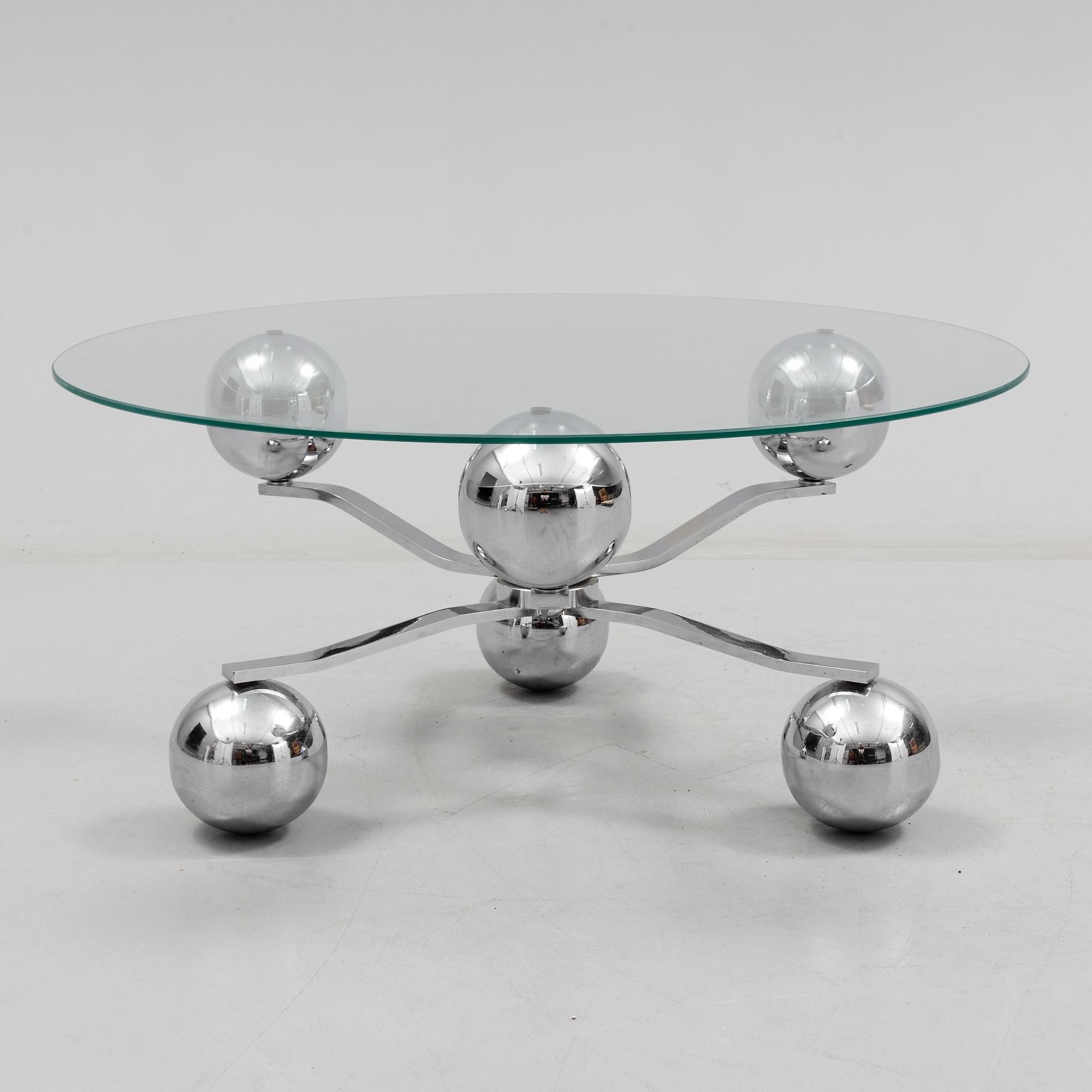 A 1960s / 70s coffee table with glass top.