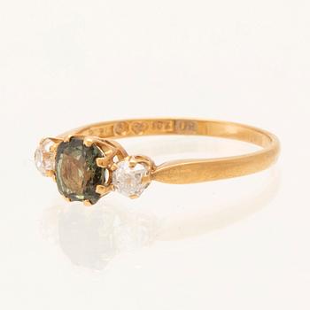 Ring in 18K gold with green faceted chrysoberyl and old-cut diamonds, Stockholm 1964.