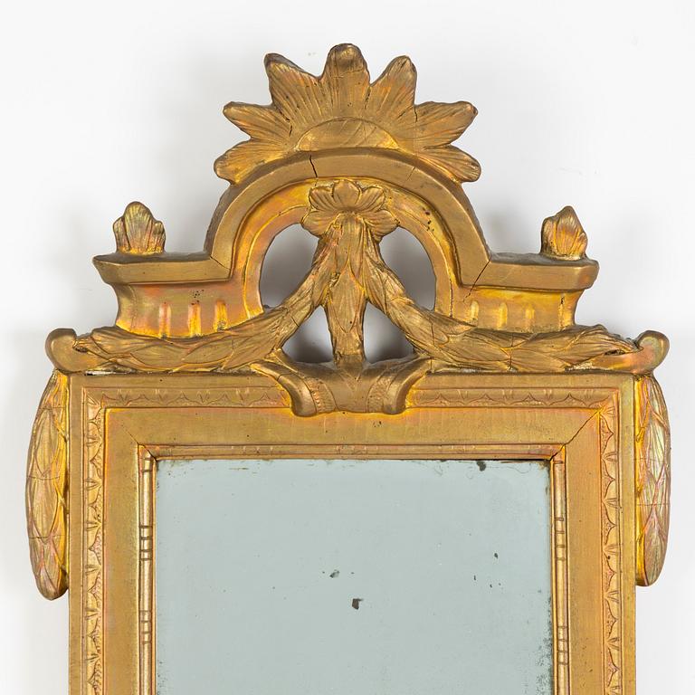 A giltwood Gustavian mirror by P. Westin (master 1776).