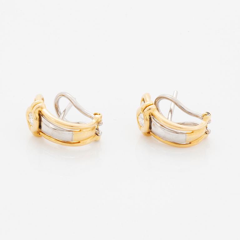 A pair of 18K gold earrings.