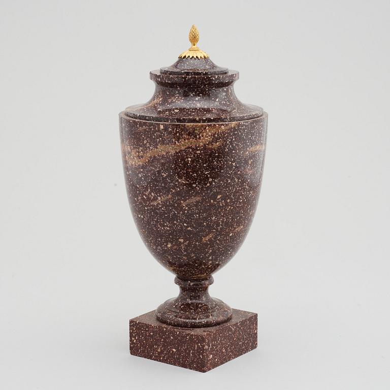 A late Gustavian 19th Century porphyry and gilt bronze urn.