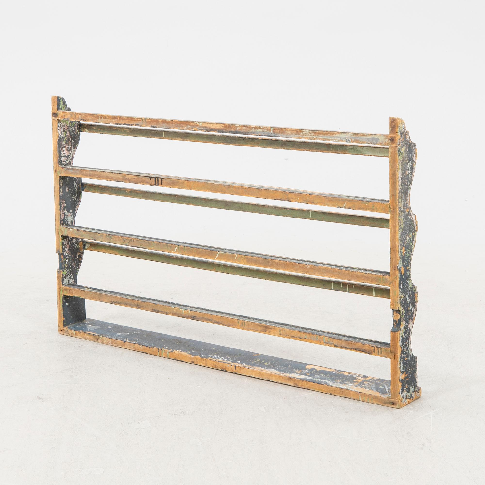 A painted early 1900s shelf.