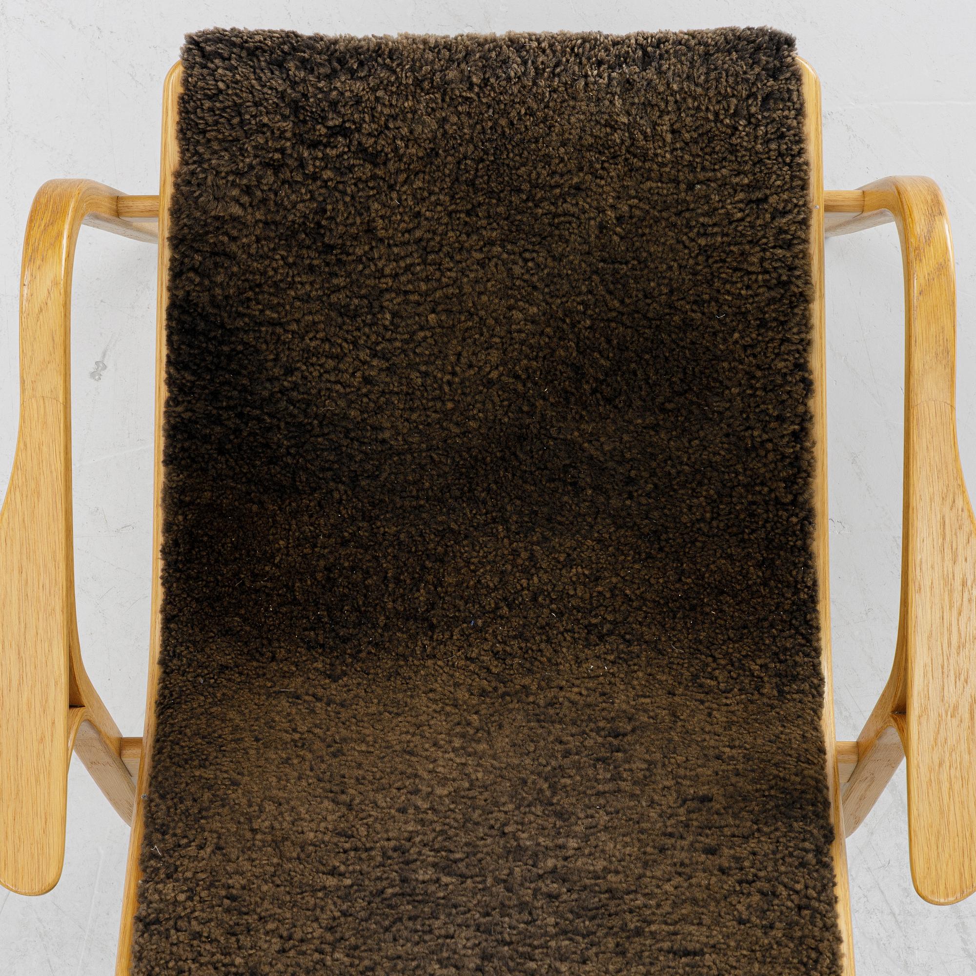 Yngve Ekström, a 'Lamino' armchair,  Swedese, 21st century.