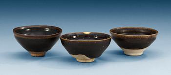 1457. A set of three odd temmoku jianyao bowls, Song dynasty (960-1279). (3).