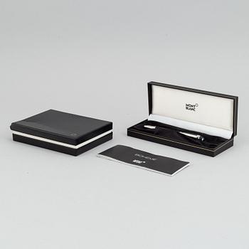 MOntblanc, a ball point pen and leather passport holder.