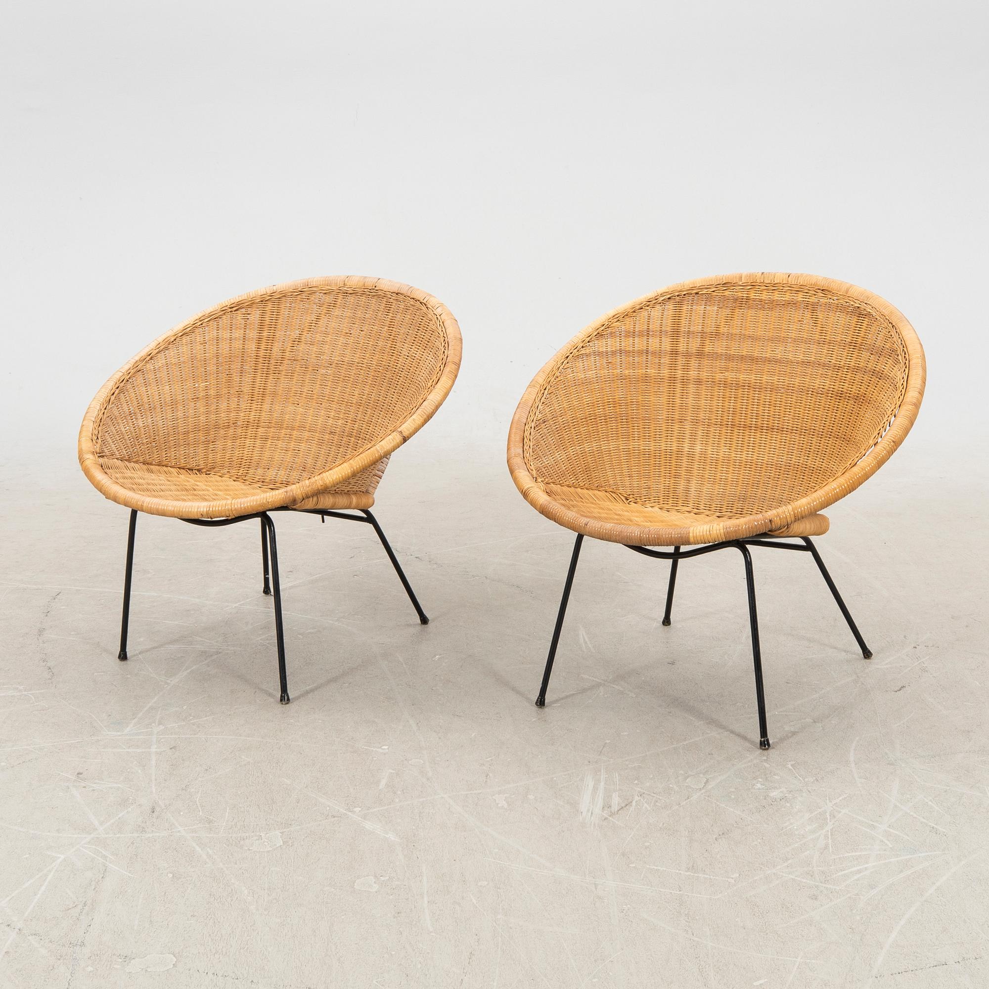 A pair of rattan 1950s easy chairs.
