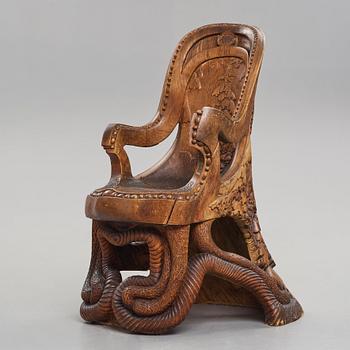 Knut Fjaestad, an Art Nouveau sculptured and carved pine throne, Sweden early 20th century.