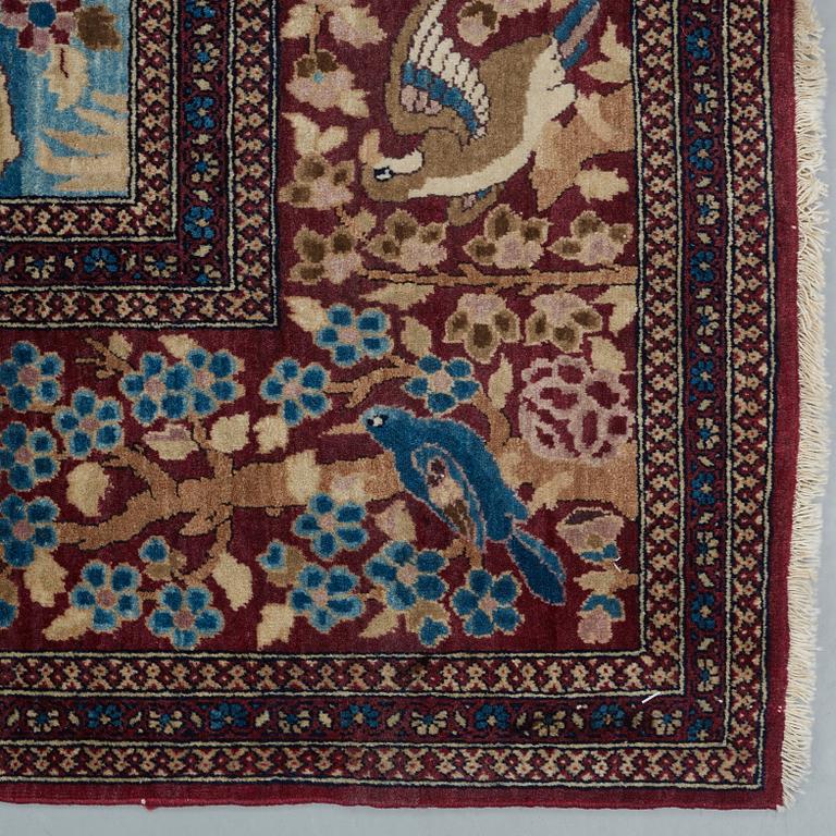 A RUG, a semi-antique Esfahan probably, figural, ca 214,5 x 137,5 cm.