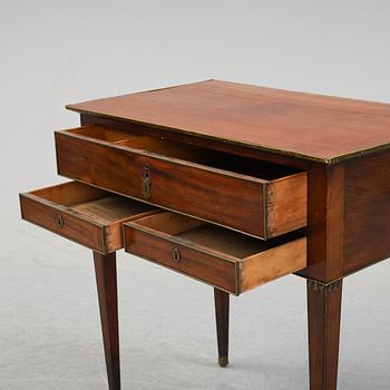 A late Gustavian mahogany tabld with drawers, end of the 18th Century.