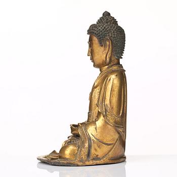 A gilt bronze figure of Amithaba Buddha, Ming dynasty (1368-1644).