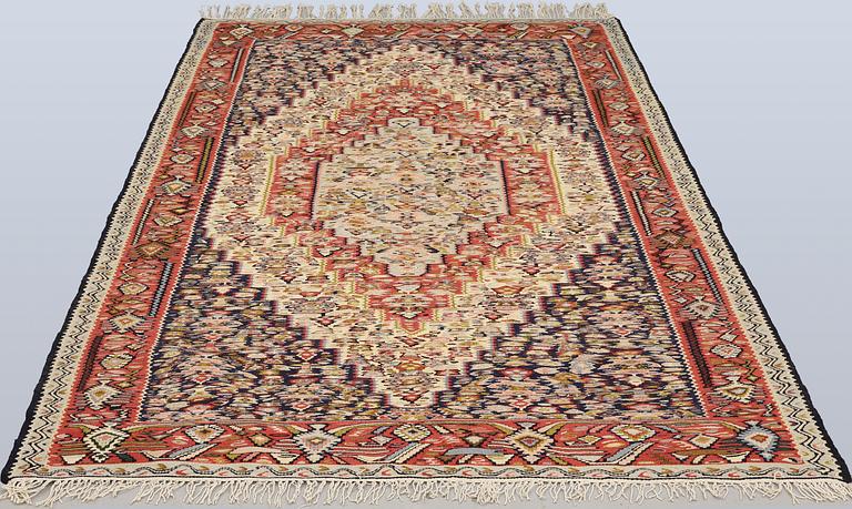 A semi-antique Kilim rug, Senneh, c. 230 x 147 cm.