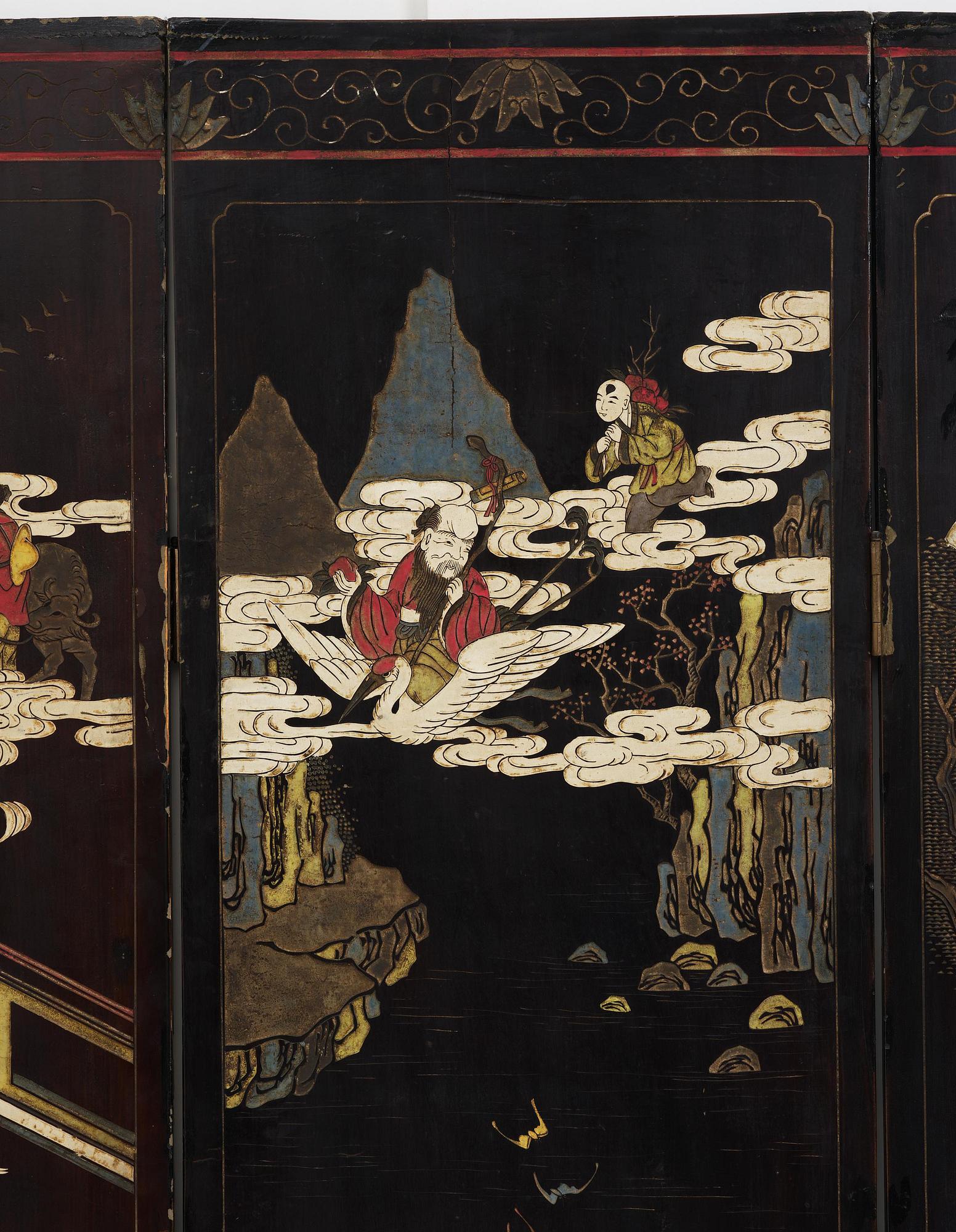 A Chinese four panel lacquer folding screen, first part of the 20th century.