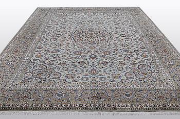 A carpet, Kashan, signed Fani, ca 420 x 300 cm.