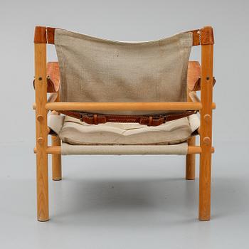 Arne Norell, a set of three "Sirocco" armchairs and two tables, Norell.