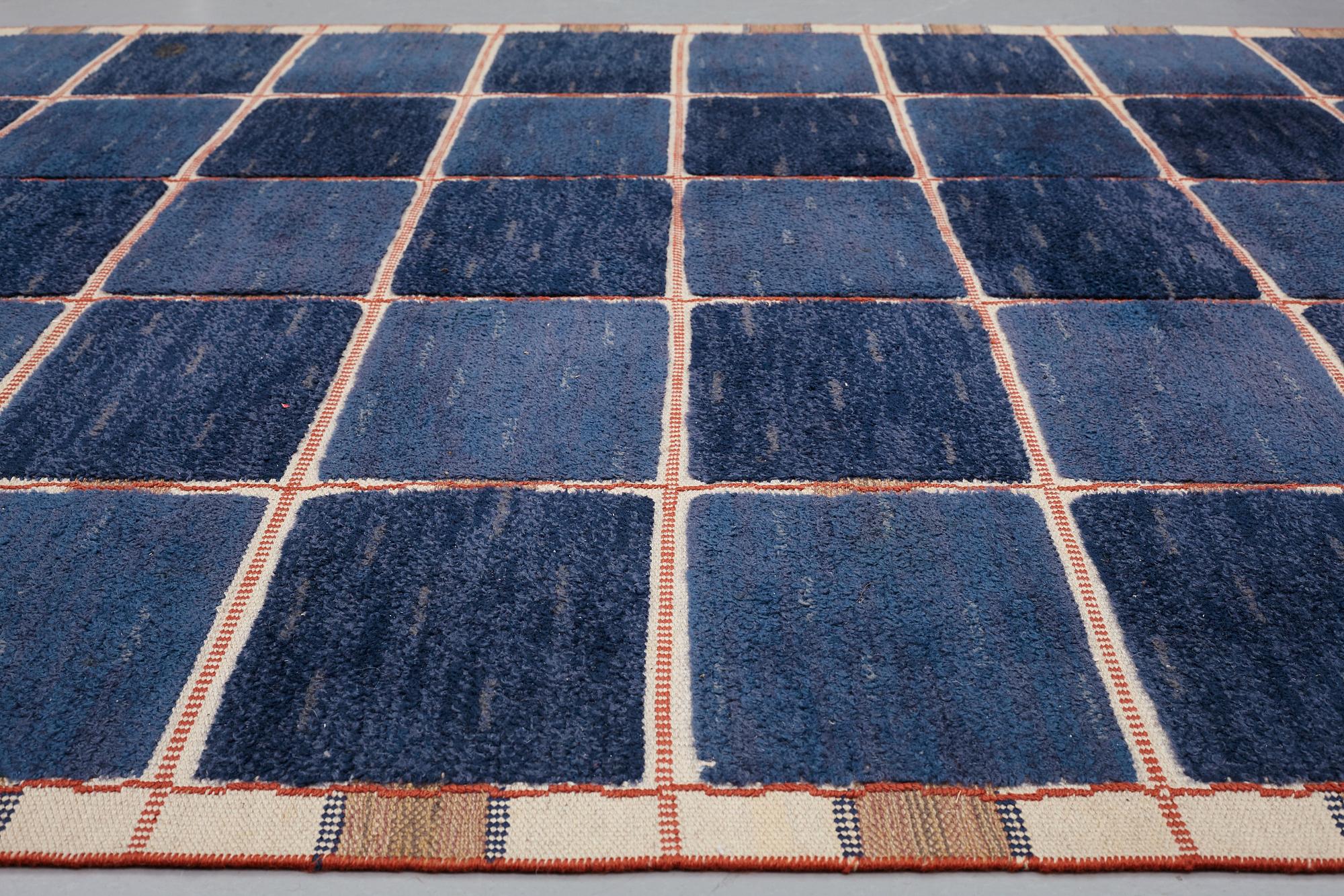 Märta Måås-Fjetterström, A CARPET, "Rutig blå halvflossa", knotted pile in relief, ca 304 x 209,5 cm, signed AB MMF.