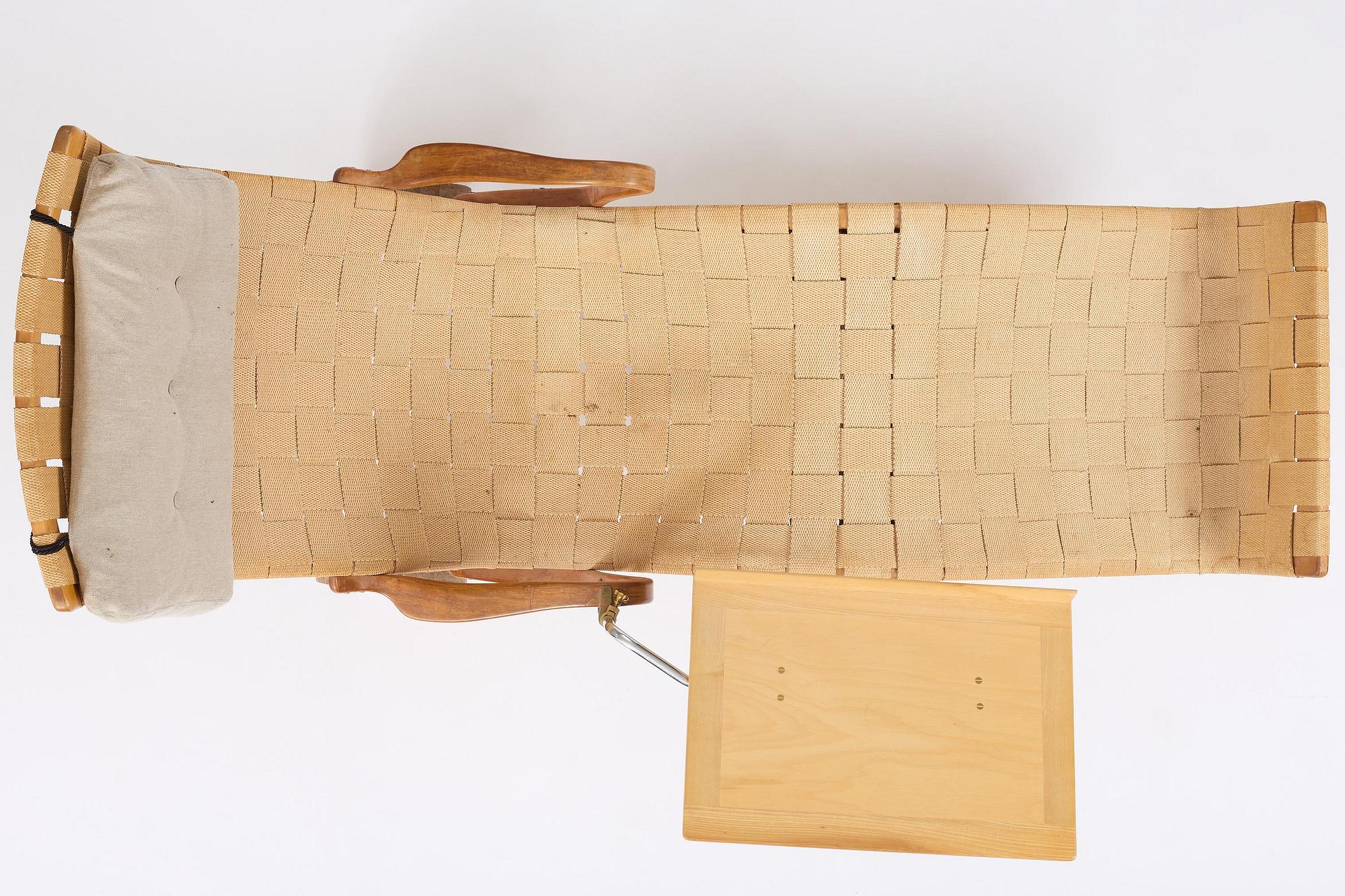 Bruno Mathsson, a lounge chair with wheels, Firma Karl Mathsson, Värnamo, 1940s, with reading table from 1972.