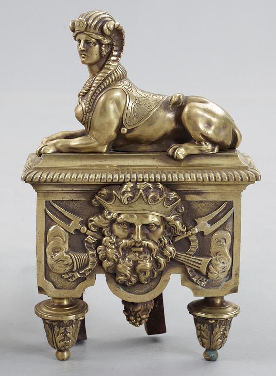 A pair of French 19th century bronze fire dogs.