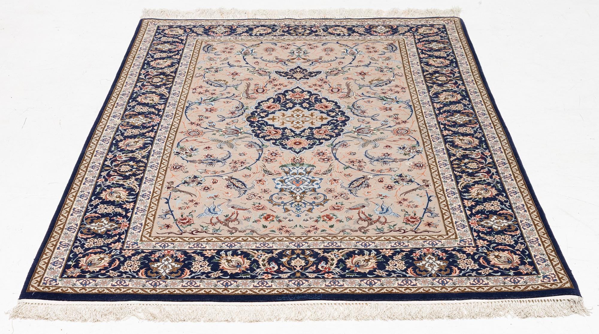 An Isfahan rug, c. 220 x 145 cm.