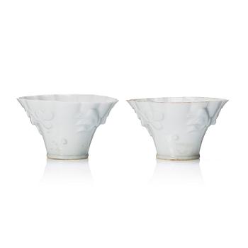 1295. A pair of blanc de chine libation cups, Qing dynasty, 19th Century.