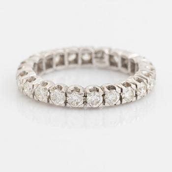 Brilliant cut diamond eternity ring.
