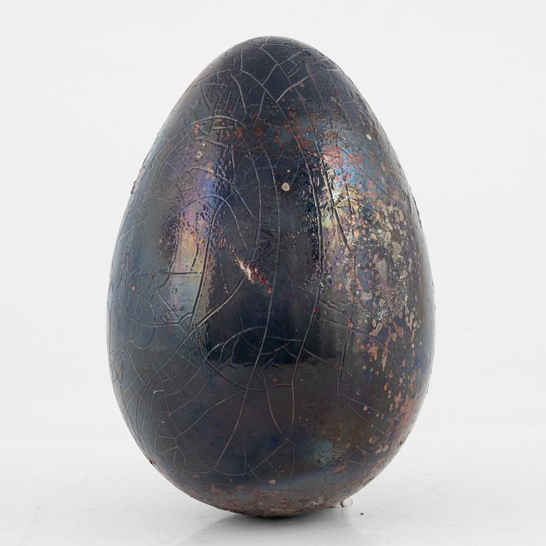 a faience sculpture of an egg, Biot, France.