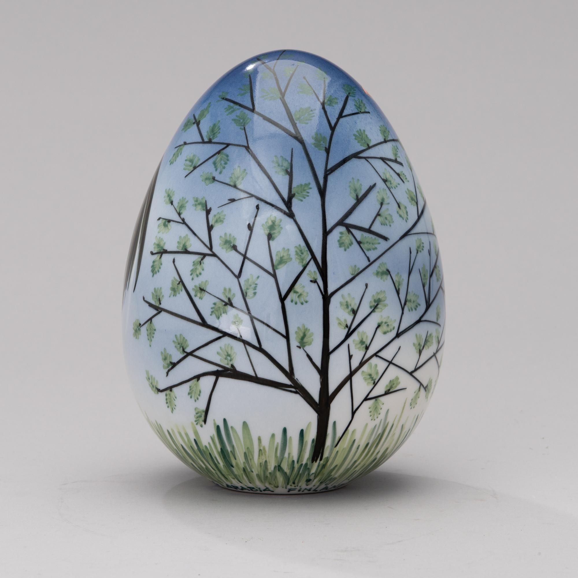A porcelain egg signed GOG Arabia Finland.