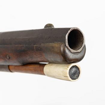 Percussion gun.