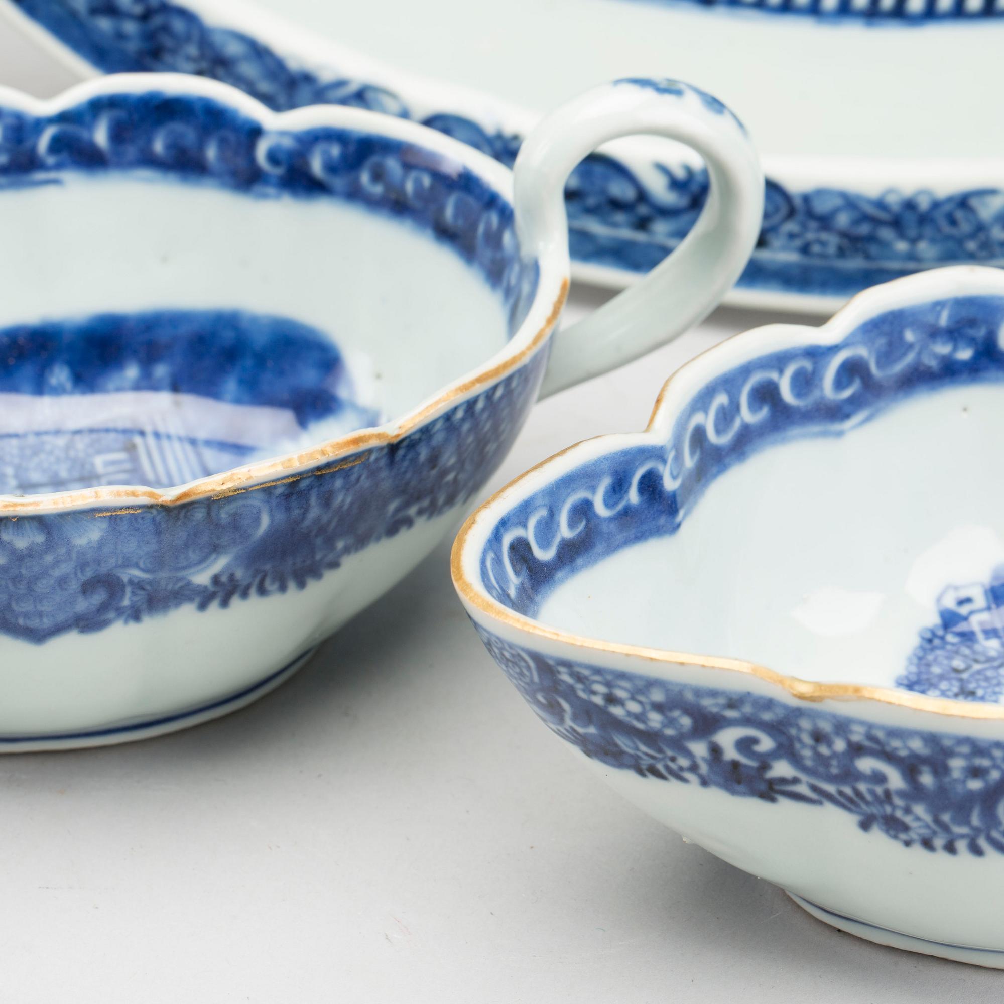 A blue and white Chinese Qianlong porcealin pair of sauce boats and a serving dish.