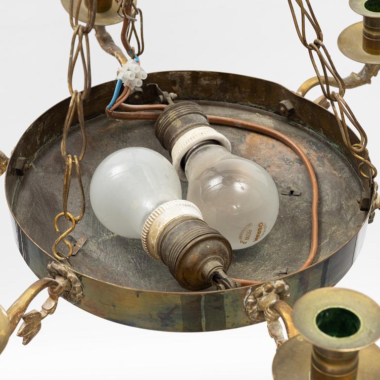 An empire style brass chandelier, around 1900.