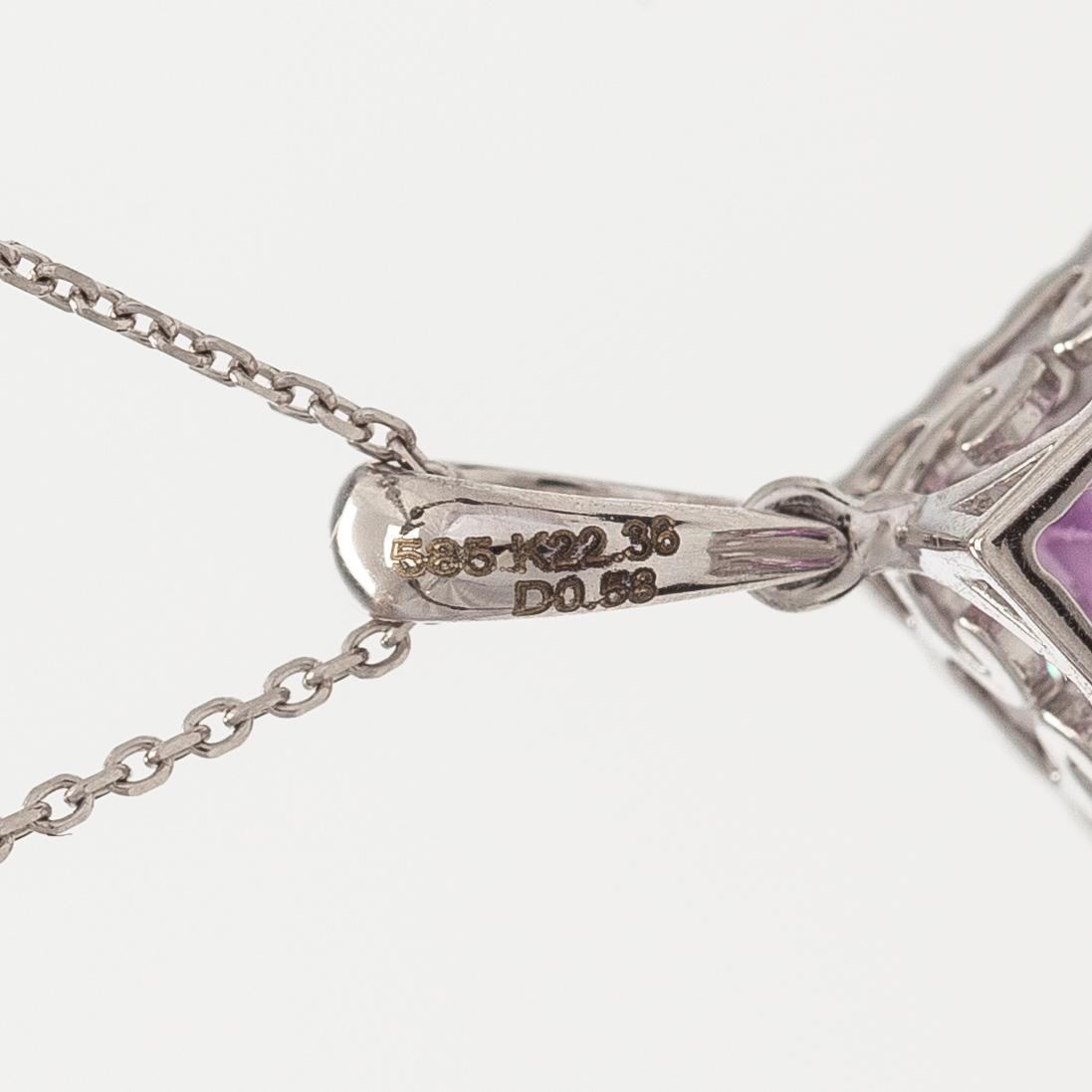 A 14K gold necklace with kunzite and brilliant cut diamonds.