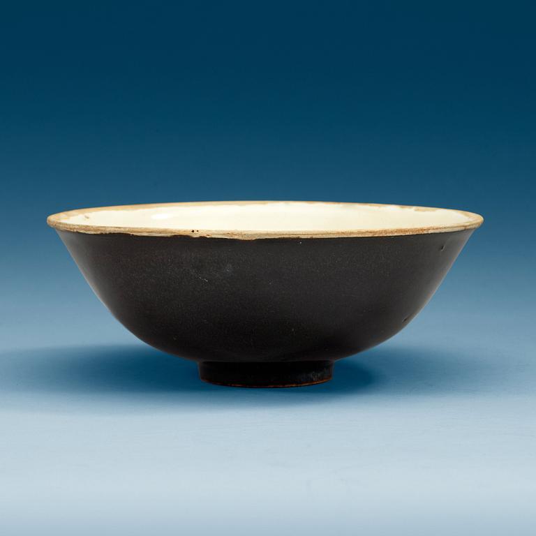 A brown and cream glazed bowl, presumably Song dynasty (960-1279).