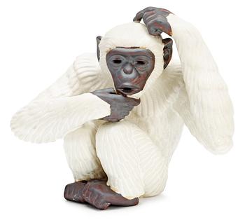 382. A Gunnar Nylund stoneware figure of an ape, Rörstrand.