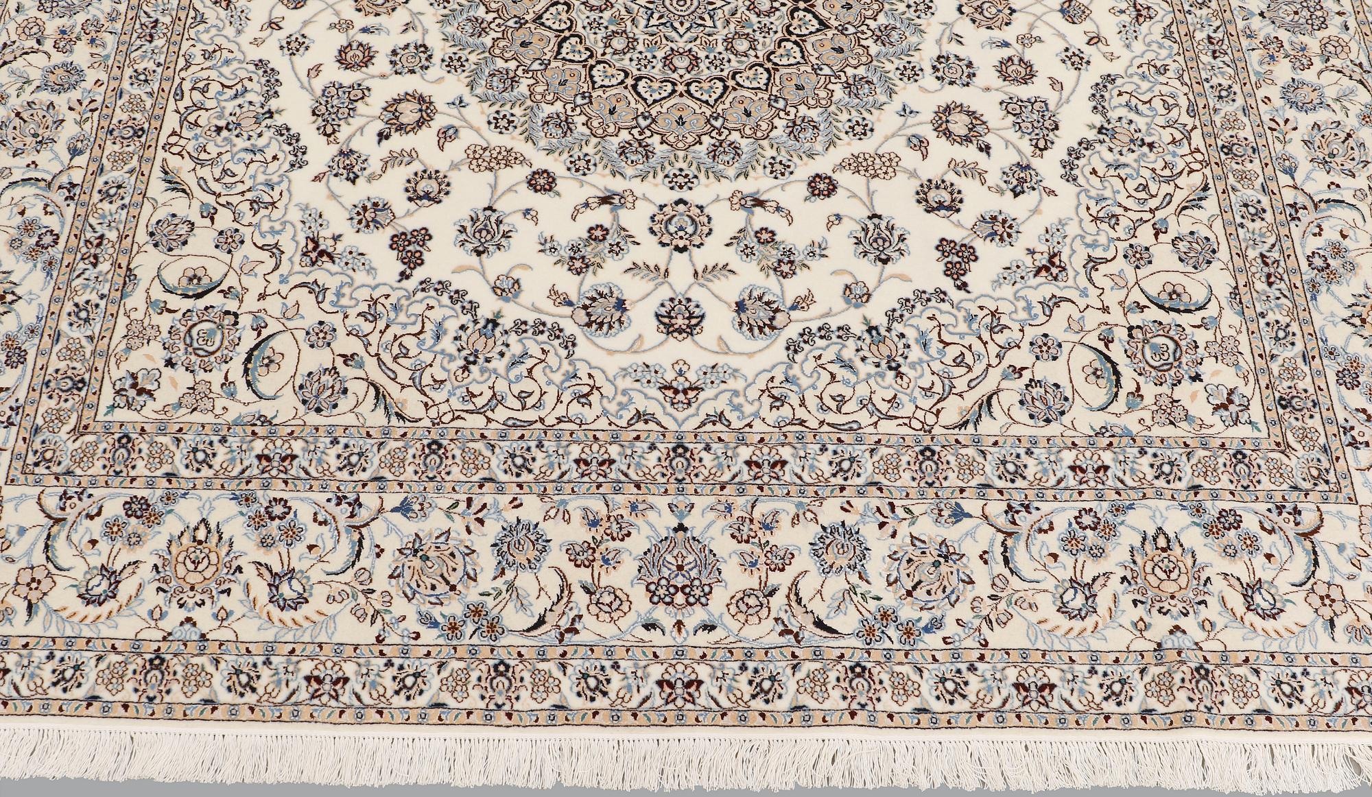A Nain part silk carpet, 210 x 200 cm.