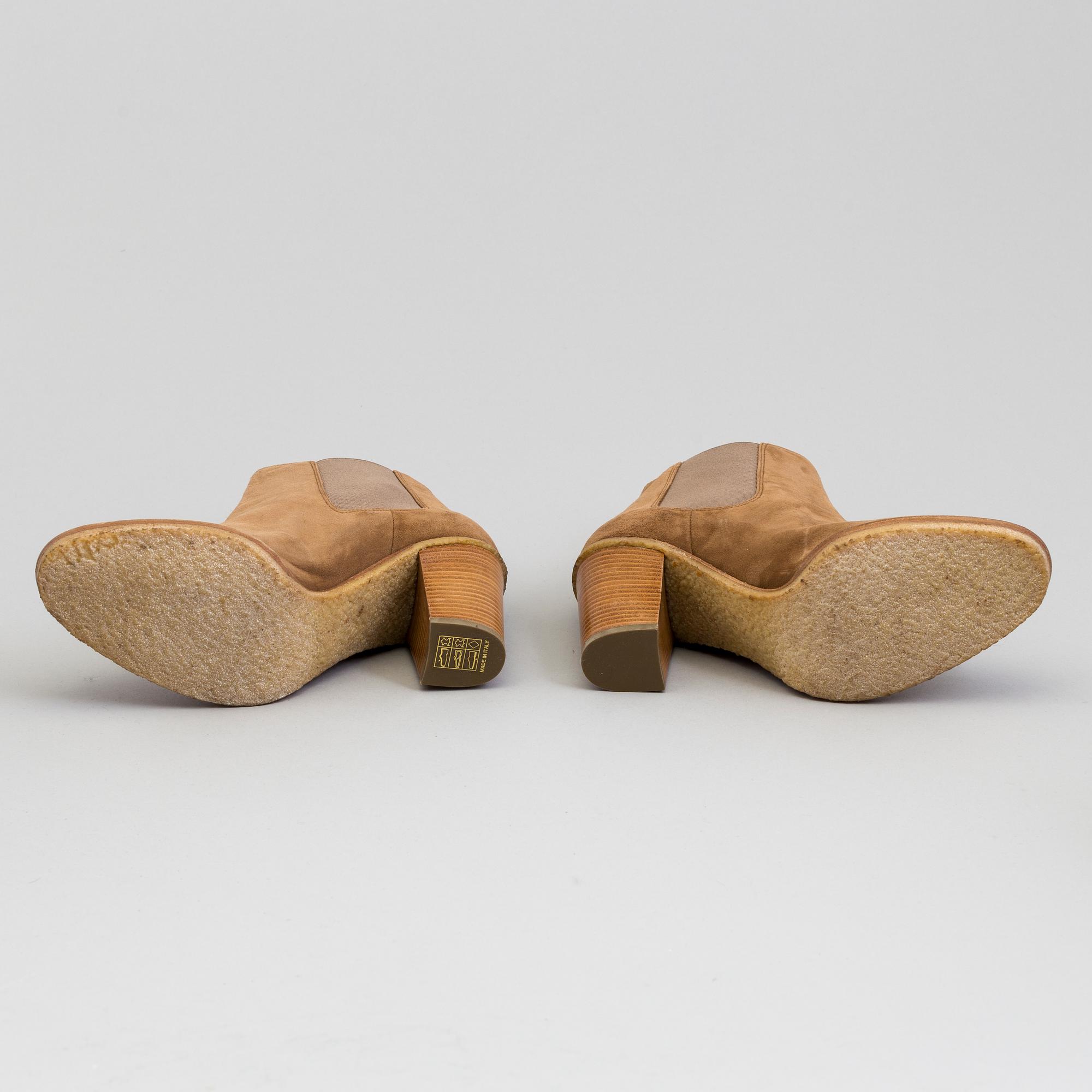 A pair of suede bootie byRalph Lauren.